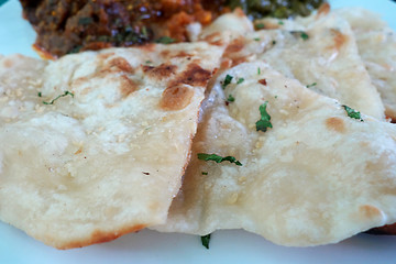 Image showing Garlic and coriander naan on a plate