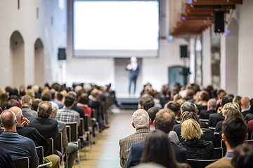 Image showing Business speaker giving a talk at business conference event.