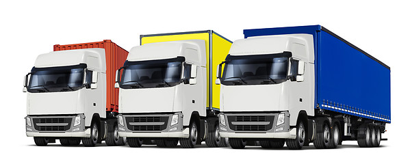 Image showing three trucks with various trailers