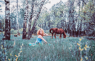 Image showing Blonde Woman Resting In The Grass