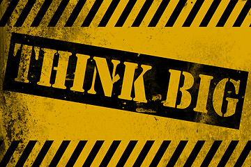 Image showing Think big sign yellow with stripes