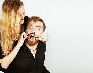 Image showing young hipster couple fooling around on white background