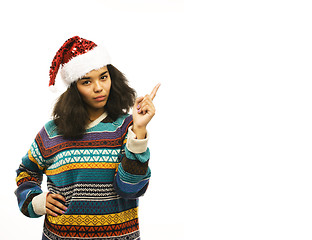 Image showing young pretty african american girl in red christmas hat isolated