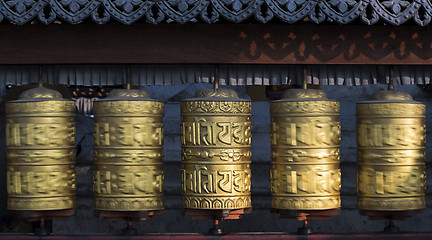 Image showing Buddhist prayer wheels rotating in motion