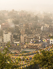 Image showing Kathmandu city view and prayer flags after sunrise