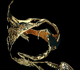 Image showing Liquid gold or oil splatter and splashes isolated on black