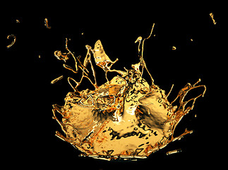 Image showing Liquid gold or oil splashes isolated on black