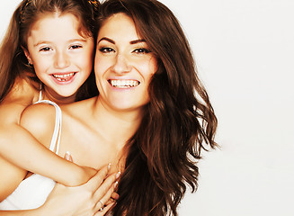 Image showing young mother with little cute daughter emotional posing on white