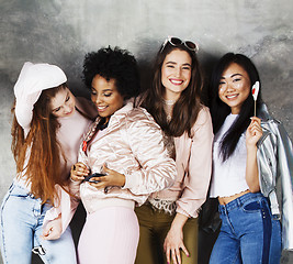 Image showing Lifestyle and people concept: young pretty diversity nations woman with different age children celebrating on birth day party together happy smiling, making selfie. African-american, asian and caucasi