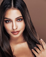 Image showing cute happy young indian woman in studio close up smiling, fashion mulatto