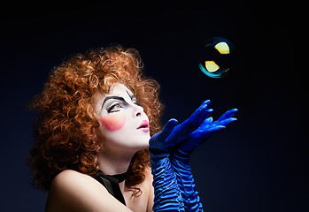 Image showing Woman mime with soap bubbles.