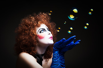 Image showing Woman mime with soap bubbles.