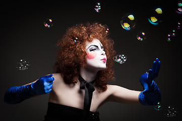 Image showing Woman mime with soap bubbles.