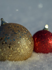 Image showing christmas balls decoration in snow