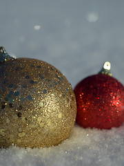 Image showing christmas balls decoration in snow