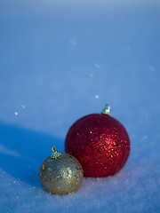 Image showing christmas balls decoration in snow