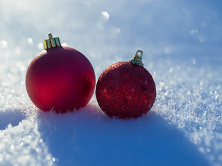 Image showing christmas balls decoration in snow