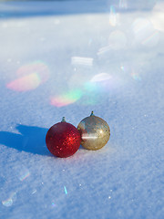 Image showing christmas balls decoration in snow