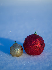 Image showing christmas balls decoration in snow