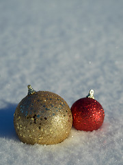 Image showing christmas balls decoration in snow