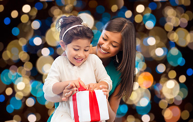 Image showing happy mother and daughter girl with gift box