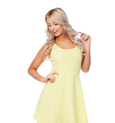 Image showing happy smiling beautiful young woman in dress