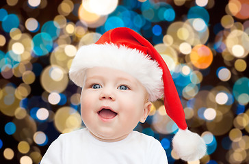 Image showing little baby boy in santa hat at christmas