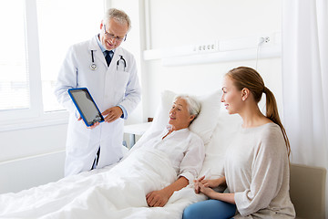 Image showing senior woman and doctor with tablet pc at hospital