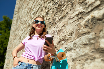 Image showing happy teenage girl with longboard and smartphone