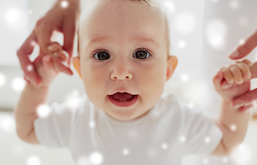 Image showing happy baby learning to walk with mother help