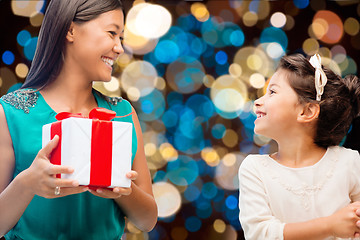 Image showing happy mother and daughter girl with gift box