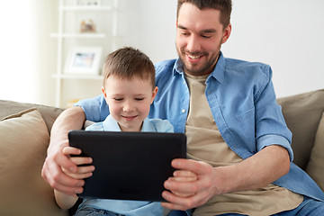 Image showing father and son with tablet pc playing at home