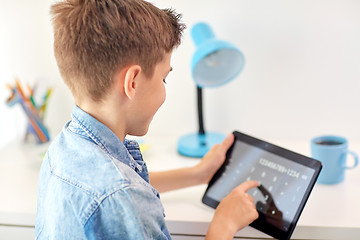 Image showing student boy counting on tablet pc calculator