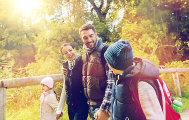 Image showing happy family with backpacks hiking