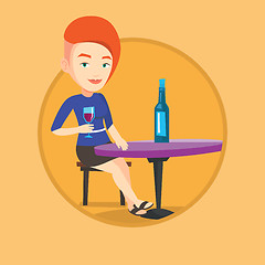 Image showing Woman drinking wine at restaurant.