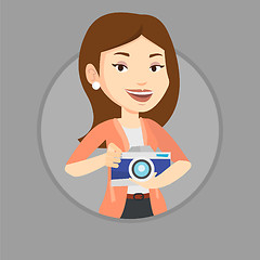 Image showing Photographer with camera in photo studio.