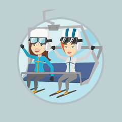 Image showing Two happy skiers using cableway at ski resort.