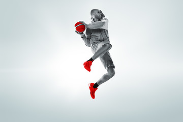 Image showing Full length portrait of a basketball player with ball