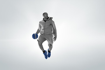 Image showing Full length portrait of a basketball player with ball