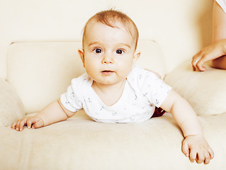 Image showing father carrying clothers for baby todler little son crying, unha