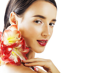 Image showing young pretty brunette real woman with red flower amaryllis close