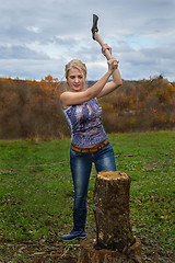 Image showing Blonde with axe