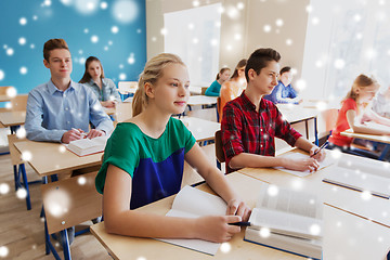 Image showing group of students with books at school lesson