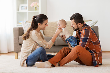 Image showing happy family with baby having fun at home