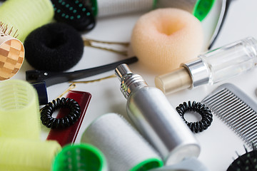 Image showing hair styling sprays, curlers and scrunchies