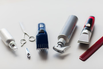 Image showing styling hair sprays, clippers, comb and scissors