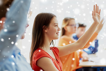 Image showing student girl raising hand at school lesson