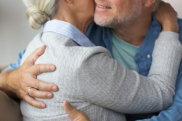 Image showing close up of married senior couple hugging