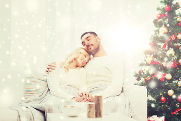 Image showing happy couple at home with christmas tree