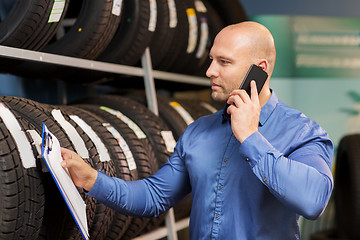 Image showing auto business owner ordering tires at car service